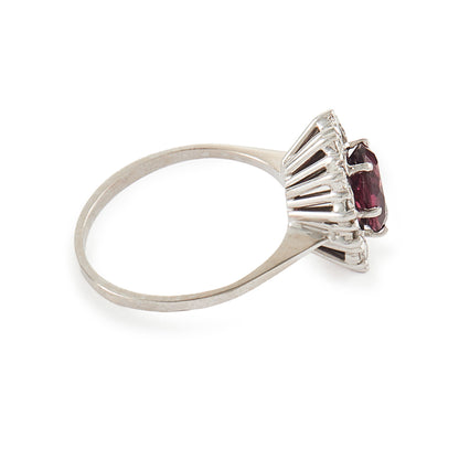 Exquisite vintage 14ct white gold ring set with a beautiful ruby-coloured rhodolite garnet surrounded by twelve natural 0.6ct diamonds.