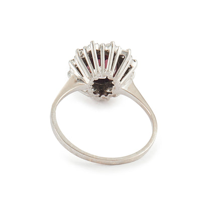 Exquisite vintage 14ct white gold ring set with a beautiful ruby-coloured rhodolite garnet surrounded by twelve natural 0.6ct diamonds.