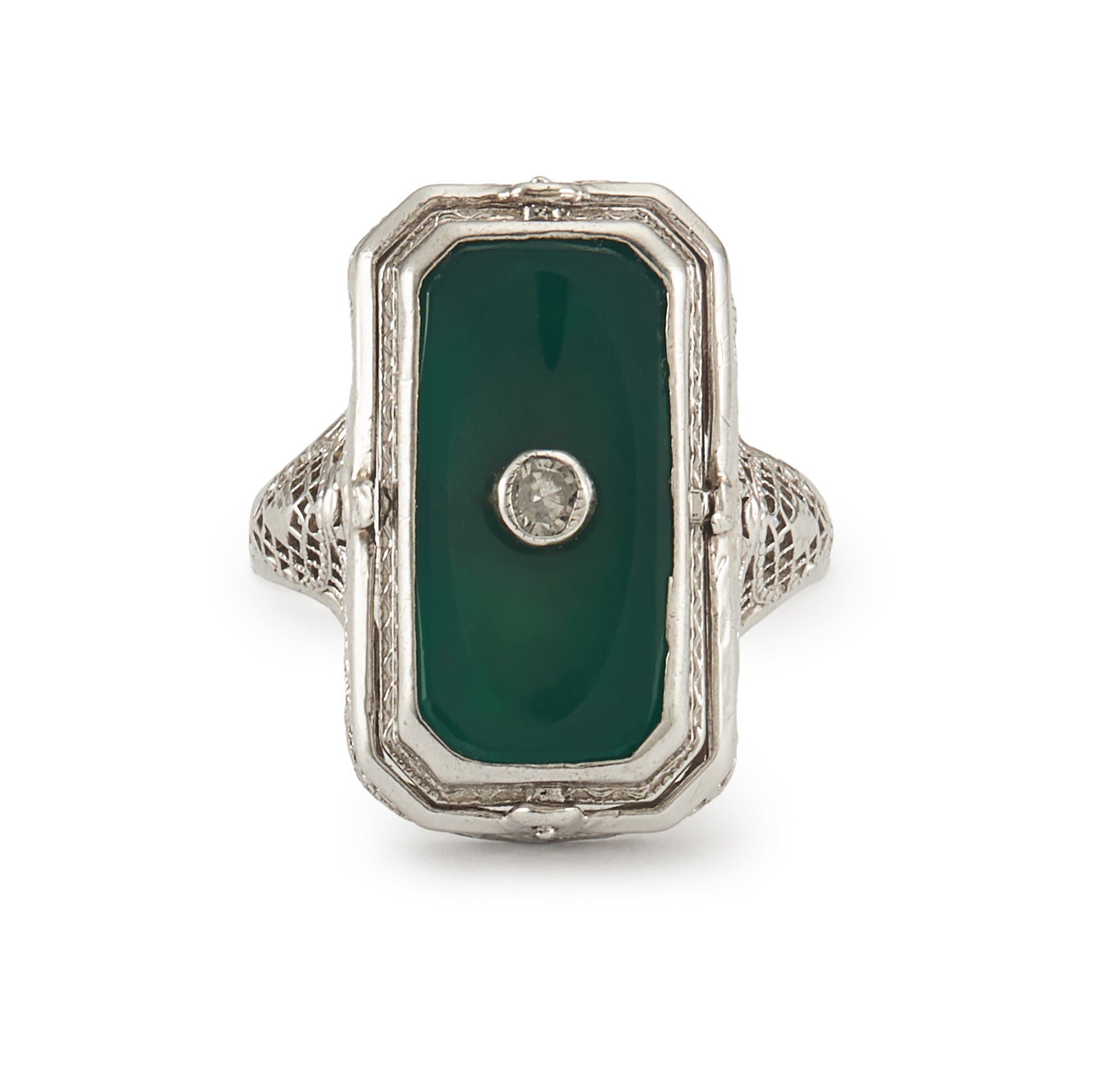 A very unusual 14ct white gold swivel ring set with a cameo of a woman wearing a diamond necklace on one side, and a green chrysoprase disc centred by a diamond on the other side. The versatile centre piece is surrounded by intricate filigree detail.