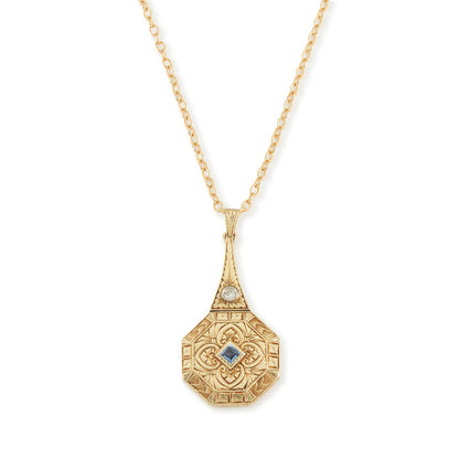 Exquisite Art Deco 15ct yellow gold pendant set with a square sapphire and a round diamond, surrounded by beautiful engraving. The pendant is on a 15ct gold belcher link chain with a barrel clasp. The compartment at the back is suitable for a picture.