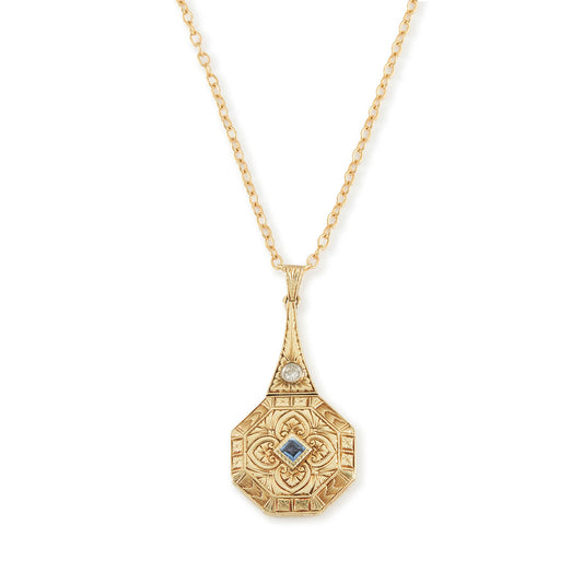 Exquisite Art Deco 15ct yellow gold pendant set with a square sapphire and a round diamond, surrounded by beautiful engraving. The pendant is on a 15ct gold belcher link chain with a barrel clasp. The compartment at the back is suitable for a picture.