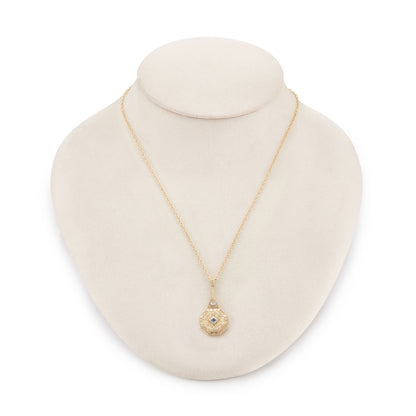 Exquisite Art Deco 15ct yellow gold pendant set with a square sapphire and a round diamond, surrounded by beautiful engraving. The pendant is on a 15ct gold belcher link chain with a barrel clasp. The compartment at the back is suitable for a picture.