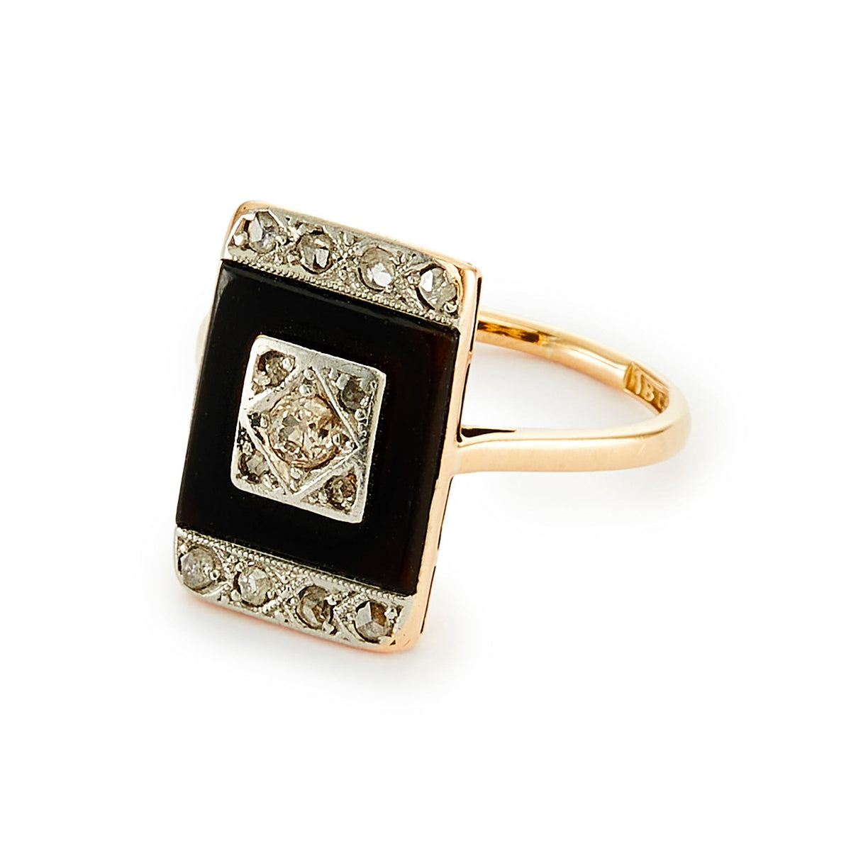 Stylish Art Deco 18ct gold ring set with an onyx disc, embellished with a centre old cut diamond, and four mine cut diamonds in a platinum setting, surrounded with smaller mine cut diamonds in a platinum setting on the edges. 