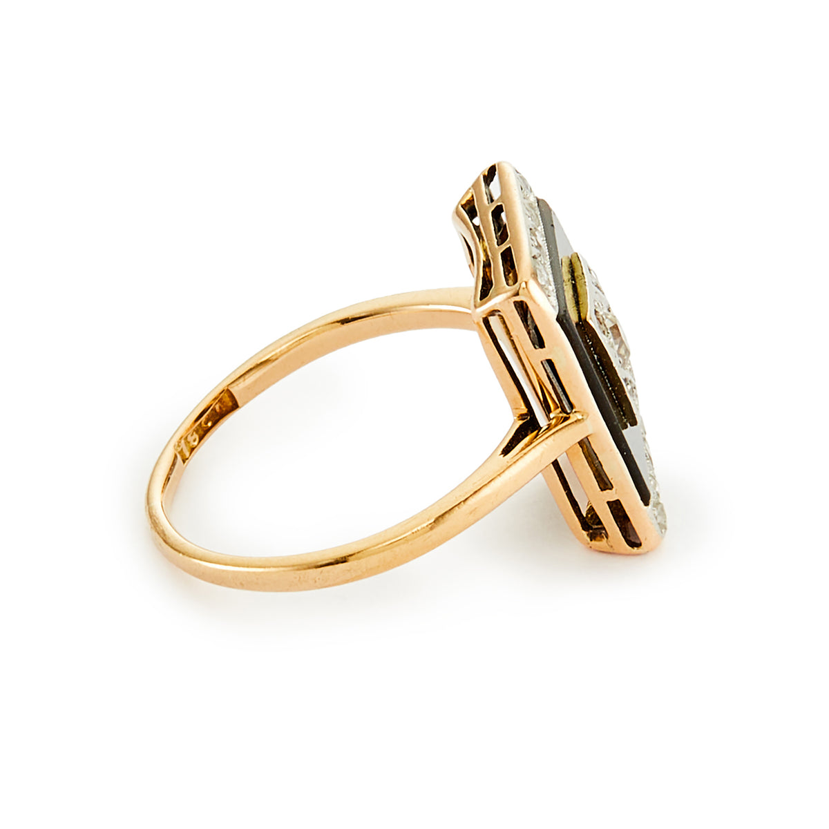 Stylish Art Deco 18ct gold ring set with an onyx disc, embellished with a centre old cut diamond, and four mine cut diamonds in a platinum setting, surrounded with smaller mine cut diamonds in a platinum setting on the edges. 