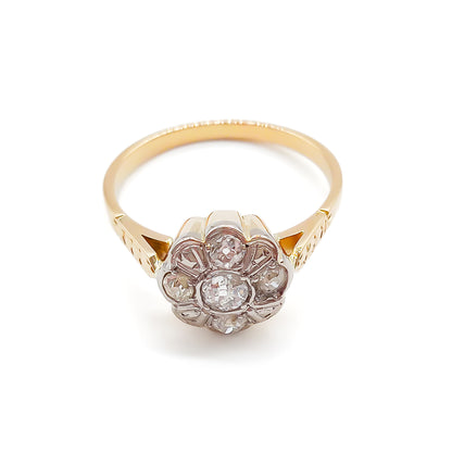  Dainty 18ct gold ring with five old-cut diamonds set in the shape of a flower. 