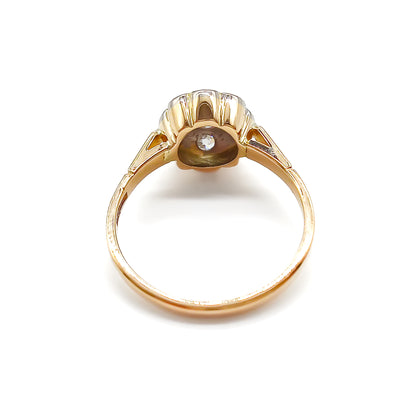  Dainty 18ct gold ring with five old-cut diamonds set in the shape of a flower. 