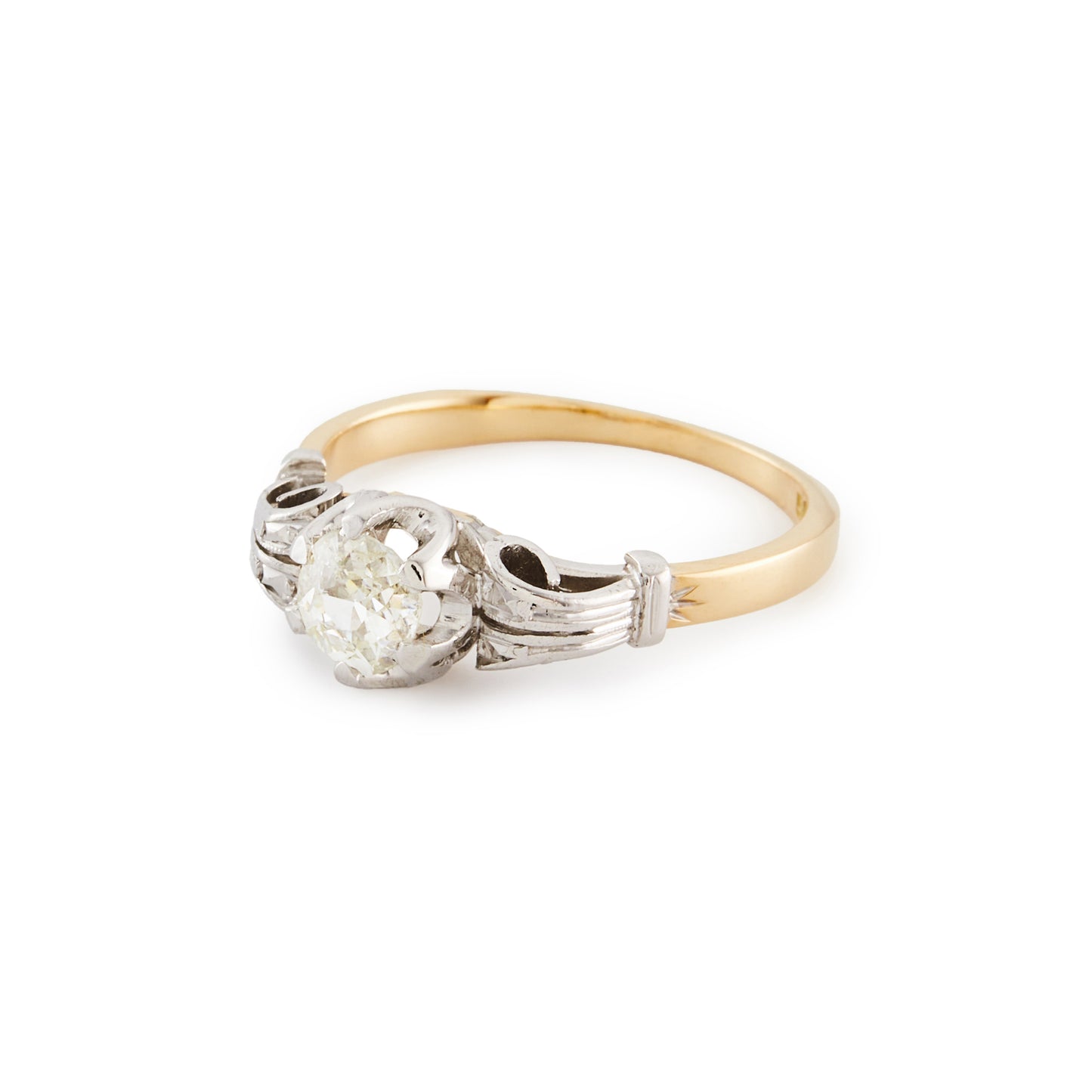 Classic 18ct gold ring, set with an old cut 0.40ct diamond in an ornate white gold setting.