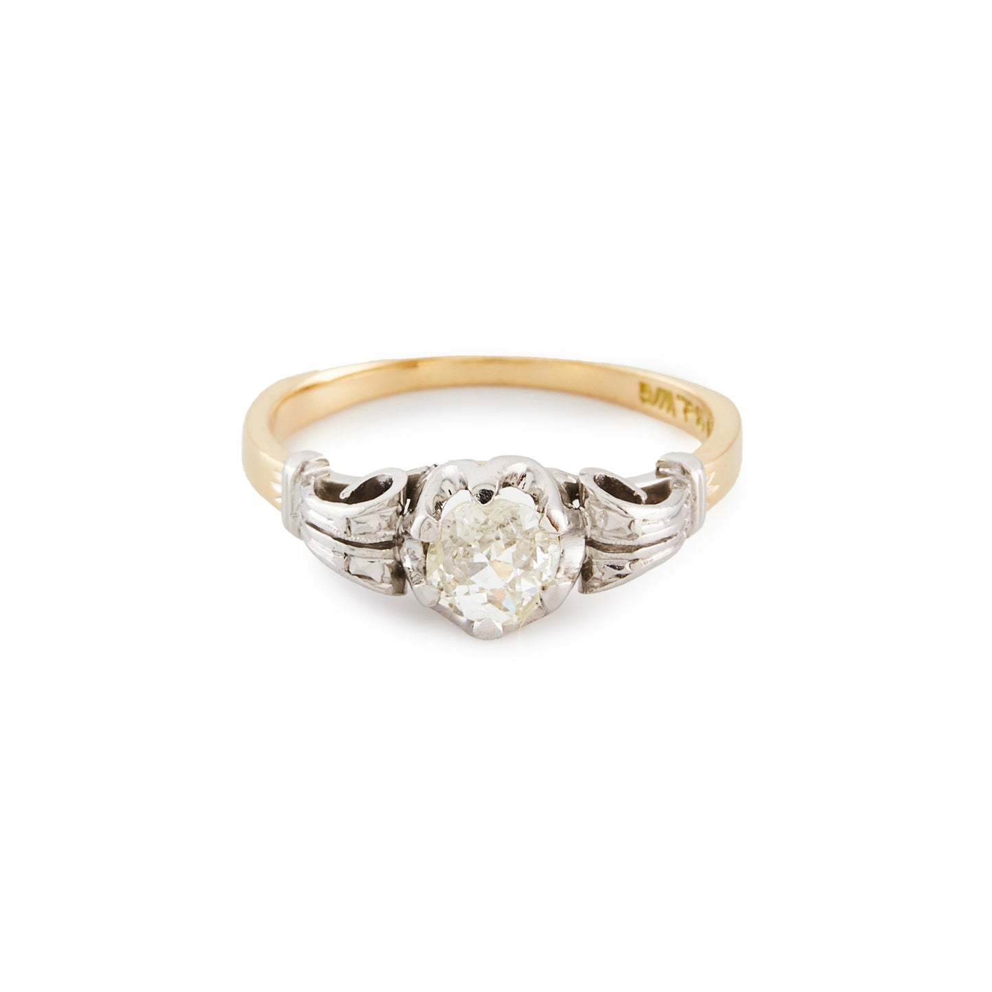 Classic 18ct gold ring, set with an old cut 0.40ct diamond in an ornate white gold setting.