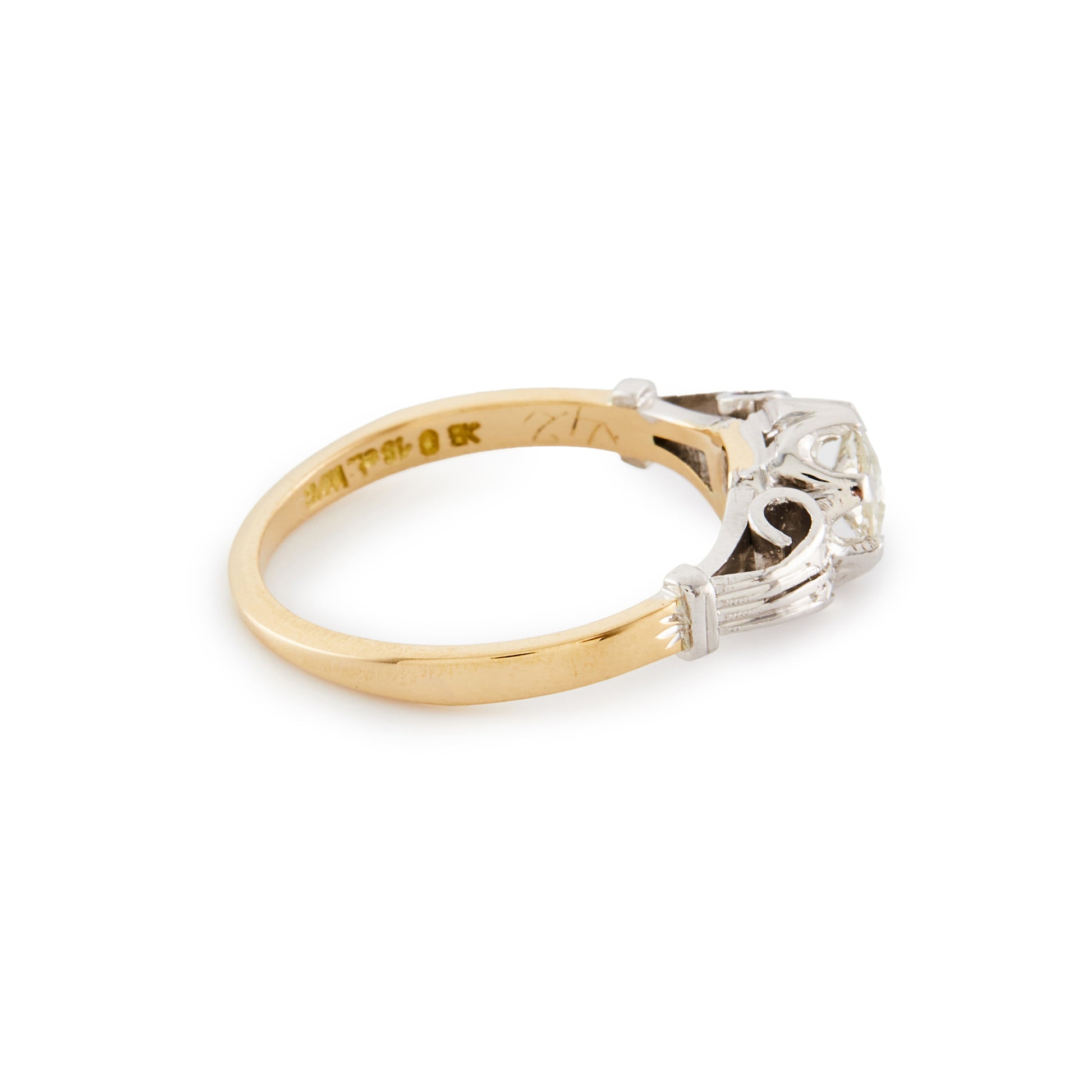 Classic 18ct gold ring, set with an old cut 0.40ct diamond in an ornate white gold setting.