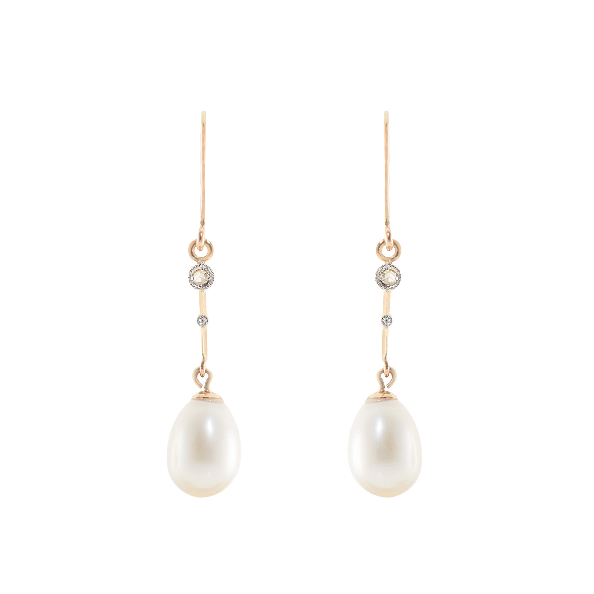 Delicate vintage 18ct gold dangling earrings, each set with a mine cut diamond and a lustrous pearl drop.