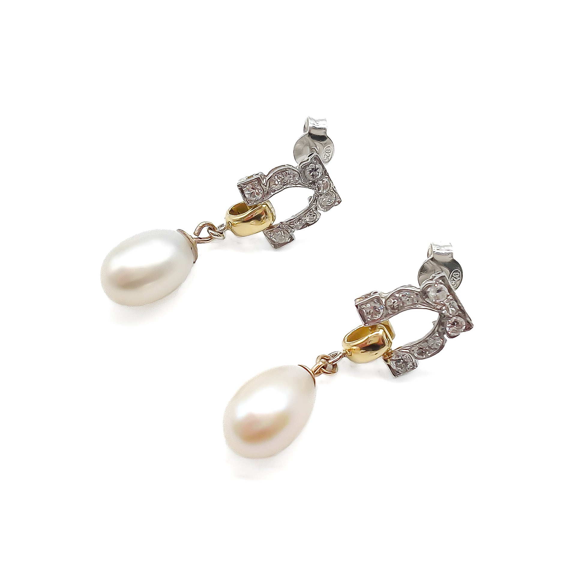 Stunning pair of 18ct white and yellow gold dangling earrings, each set with six small diamonds and a pearl drop.