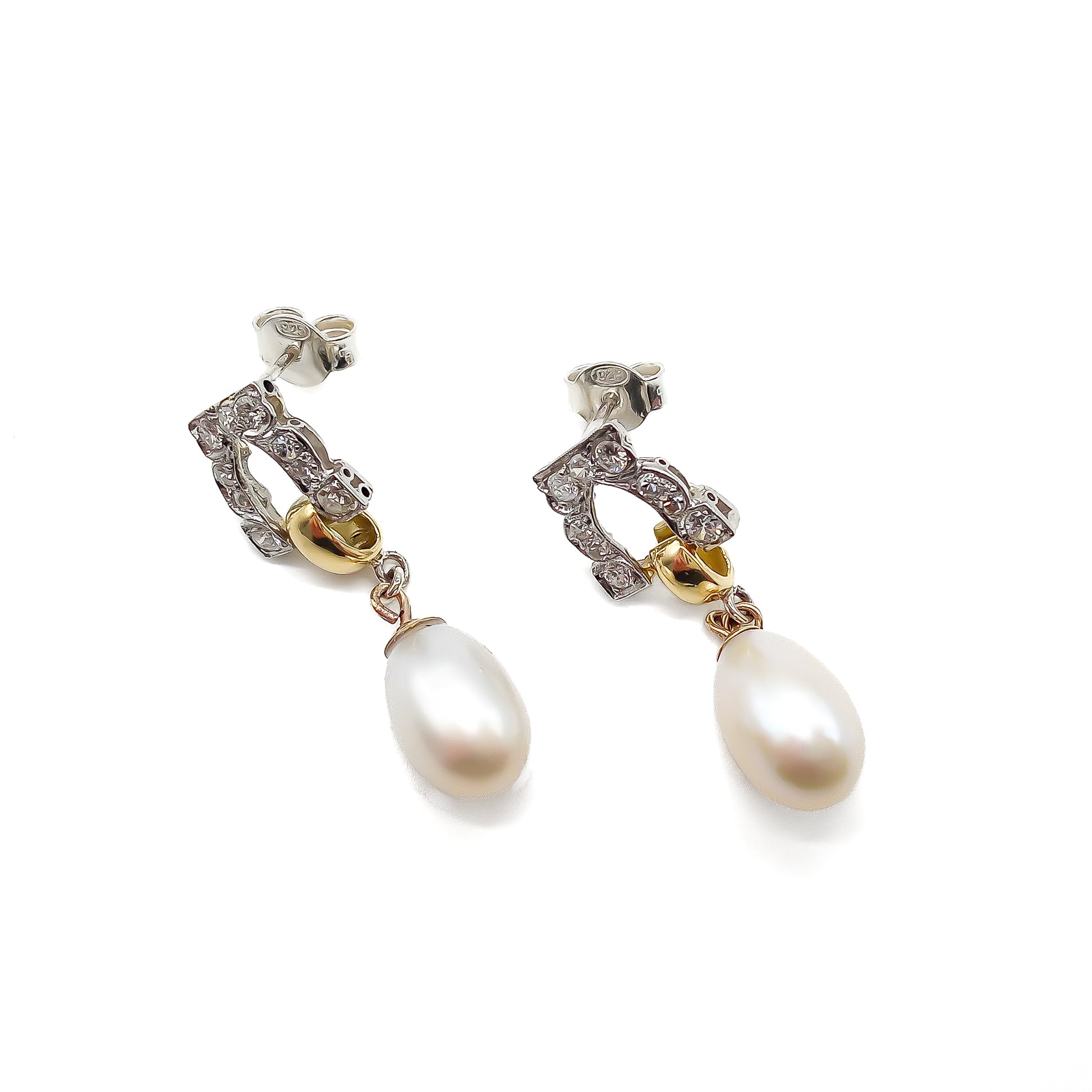 Stunning pair of 18ct white and yellow gold dangling earrings, each set with six small diamonds and a pearl drop.