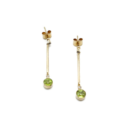 Classic 18ct gold drop earrings, each set with two small diamonds and a beautifully faceted peridot.