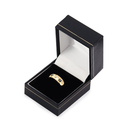 Classic 18ct gold Edwardian Gypsy ring set a natural, 0.15ct rose-cut diamond, with a faceted sapphire on each side.