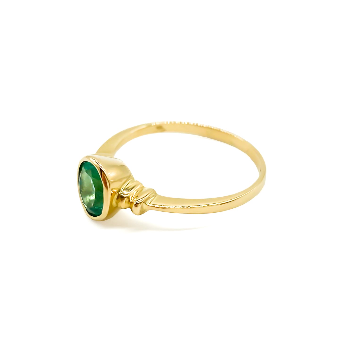 Vintage 18ct yellow gold ring set with a gorgeous bright green oval emerald. Argentina