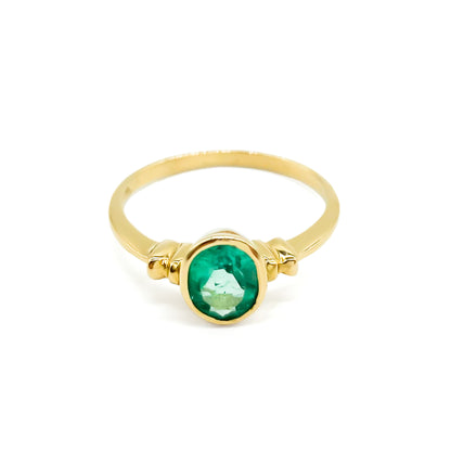 Vintage 18ct yellow gold ring set with a gorgeous bright green oval emerald. Argentina