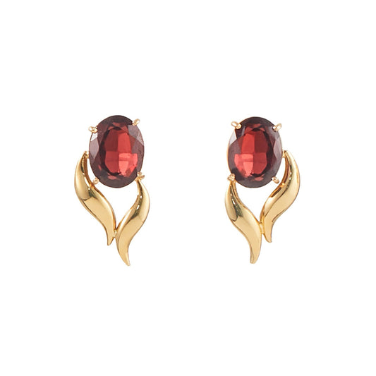 Classic 18ct gold stud earrings, each set with a deep red, beautifully faceted garnet gemstone.
