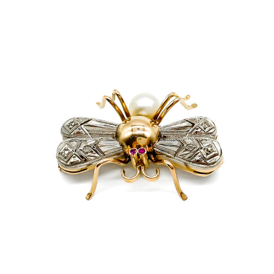 Charming 18ct white and rose gold insect brooch with diamond encrusted wings, ruby eyes and a pearl abdomen.