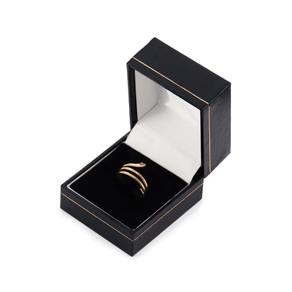 Charming 18ct gold coiling serpent ring set with a small cabochon ruby in the head. Italy