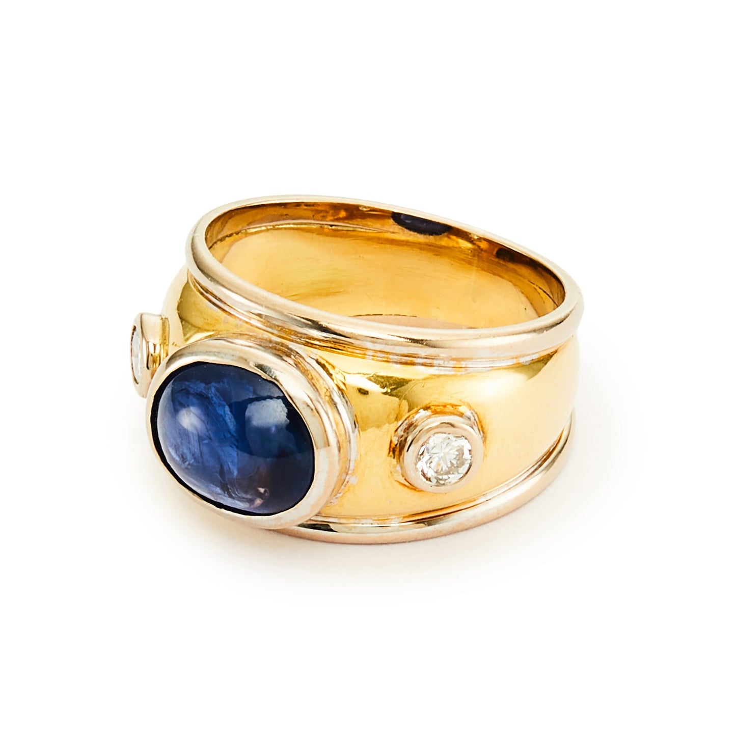 Glamorous 18ct yellow and white gold ring tube-set with a centre cabochon sapphire and a natural diamond on each side.