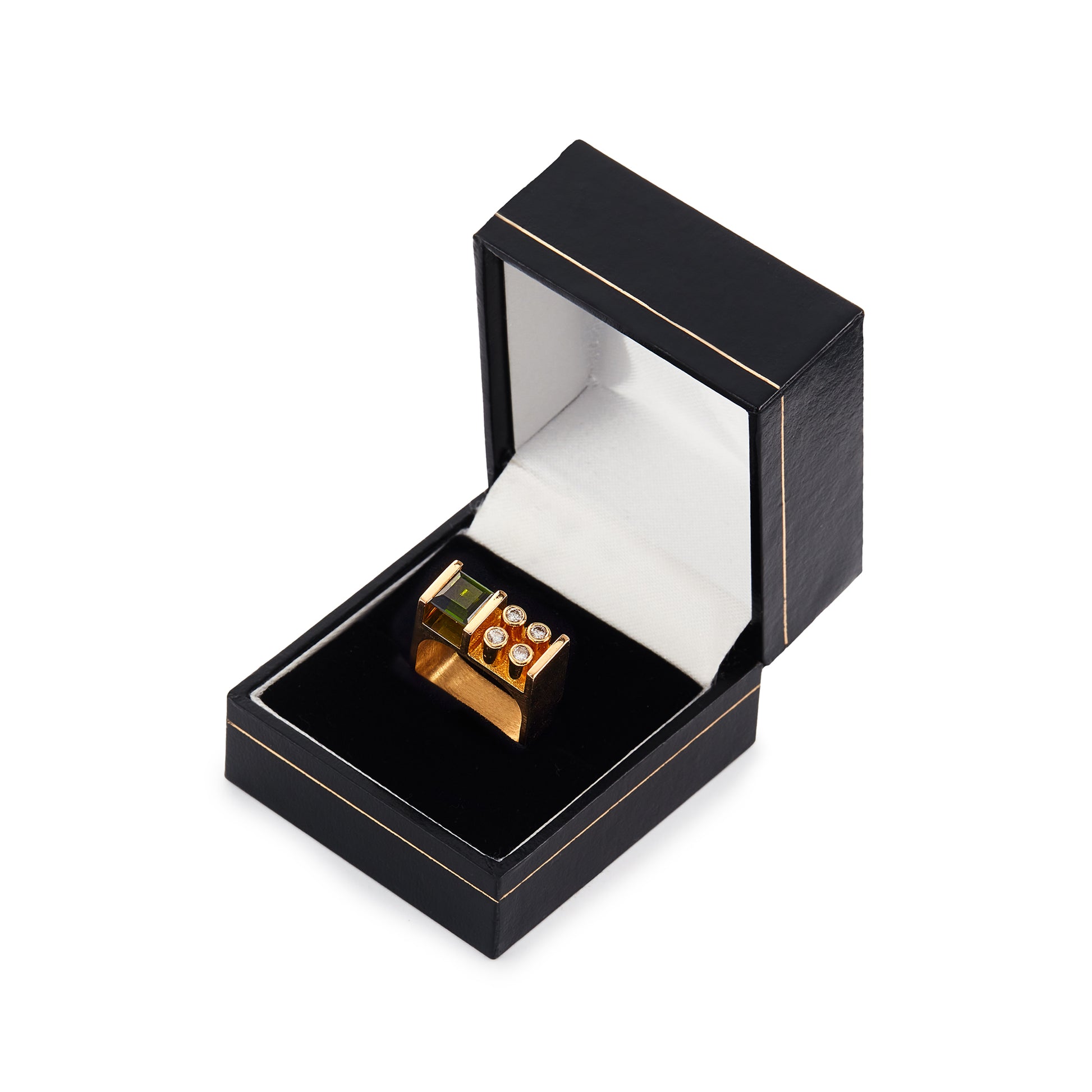 Very stylish 18ct yellow gold Erich Fry designer ring set with a princess cut green tourmaline and four round diamonds.
Circa 1970s