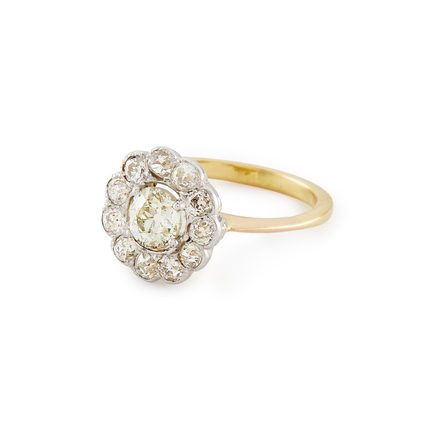 Stylish 18ct gold ring with a 0.60ct old cut diamond in a platinum halo setting, consisting of eleven 0.10ct old cut diamonds. Circa 1920’s