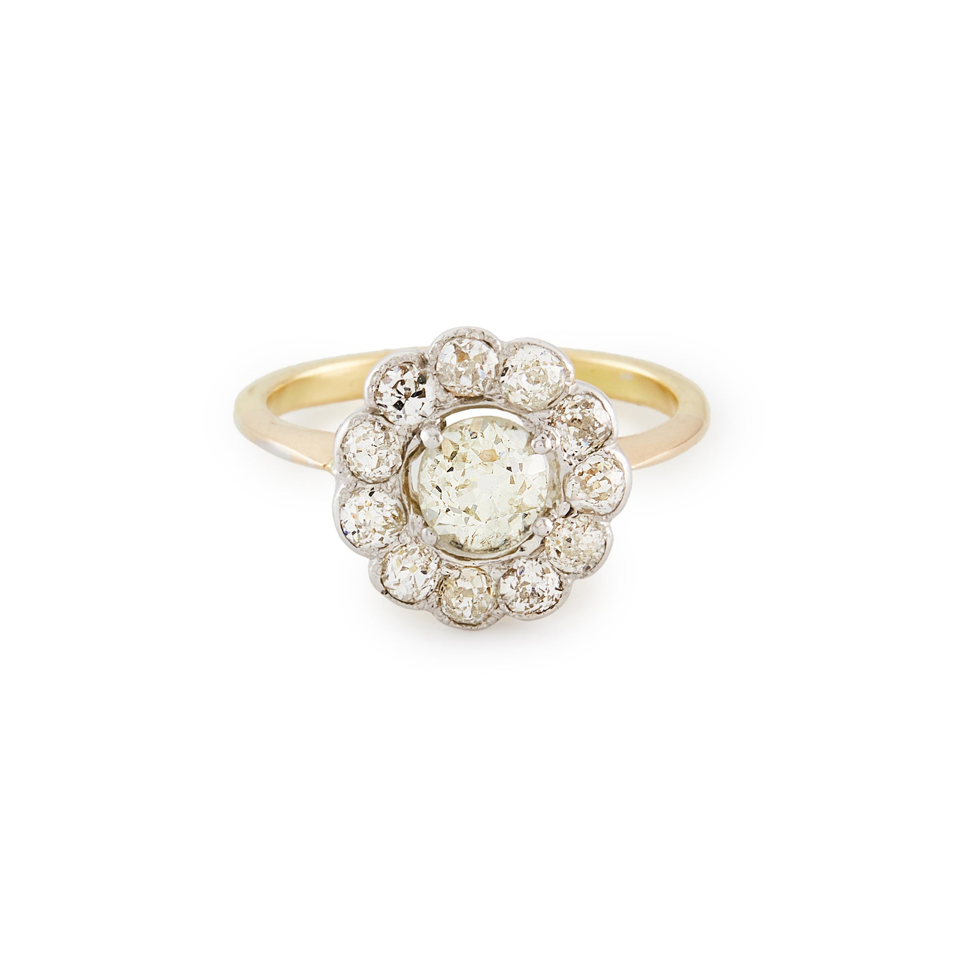 Stylish 18ct gold ring with a 0.60ct old cut diamond in a platinum halo setting, consisting of eleven 0.10ct old cut diamonds. Circa 1920’s