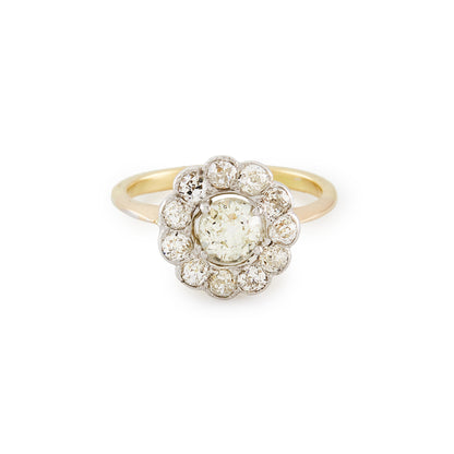 Stylish 18ct gold ring with a 0.60ct old cut diamond in a platinum halo setting, consisting of eleven 0.10ct old cut diamonds. Circa 1920’s