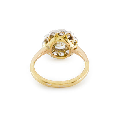 Stylish 18ct gold ring with a 0.60ct old cut diamond in a platinum halo setting, consisting of eleven 0.10ct old cut diamonds. Circa 1920’s