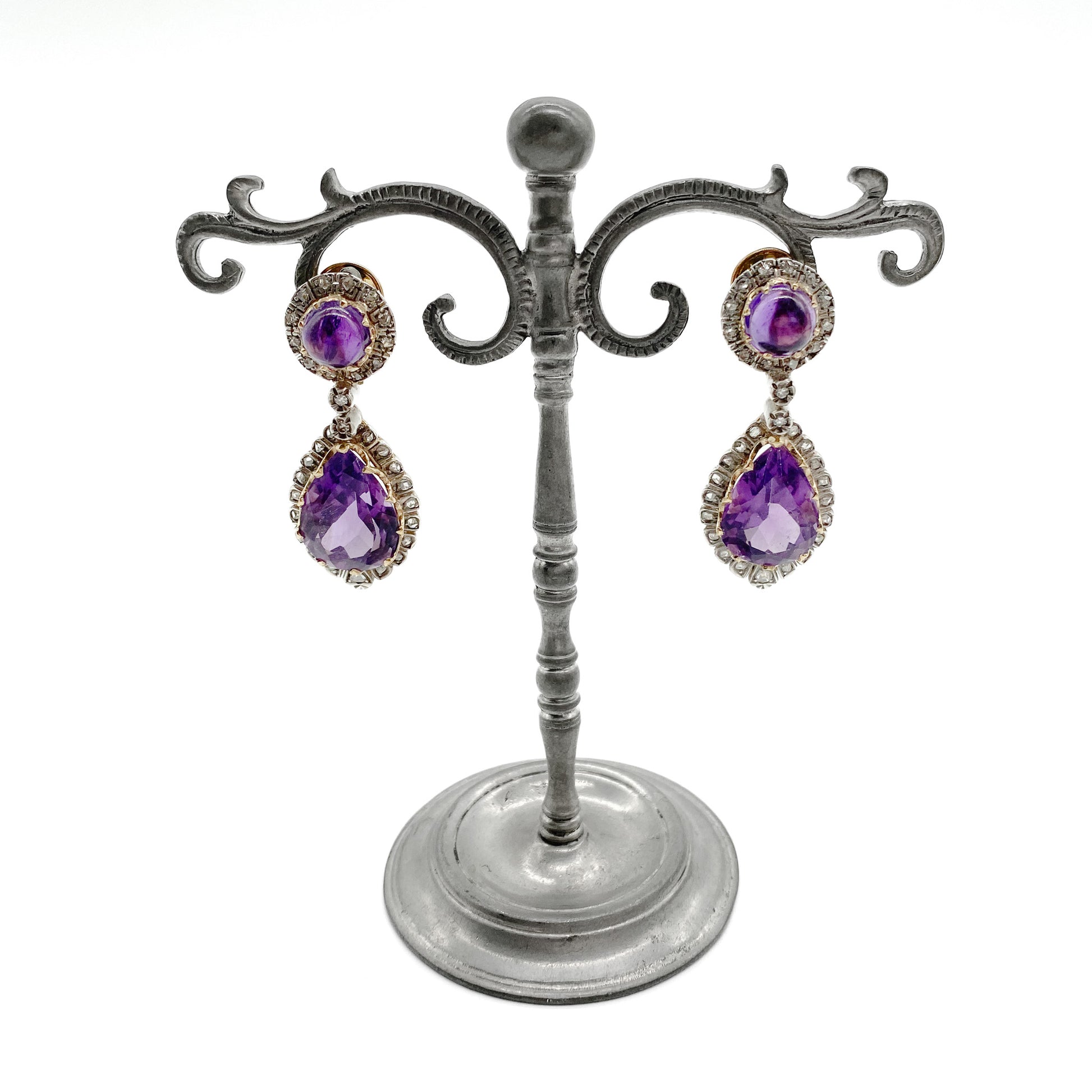 Magnificent antique 18ct yellow gold and silver articulated drop earrings, each set with a teardrop shaped faceted amethyst and a round cabochon amethyst, surrounded by thirty-one mine-cut diamonds and two old-cut diamonds.