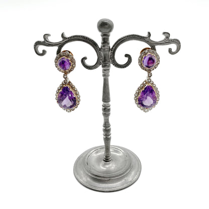 Magnificent antique 18ct yellow gold and silver articulated drop earrings, each set with a teardrop shaped faceted amethyst and a round cabochon amethyst, surrounded by thirty-one mine-cut diamonds and two old-cut diamonds.