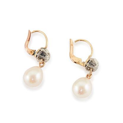 Lovely 18ct gold earrings, each with an old-European-cut diamond in a silver setting, and a dangling pearl drop.