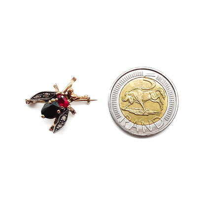 Charming 18ct rose gold and silver insect brooch set with a faceted onyx, garnet and four flat-cut diamonds. Italy