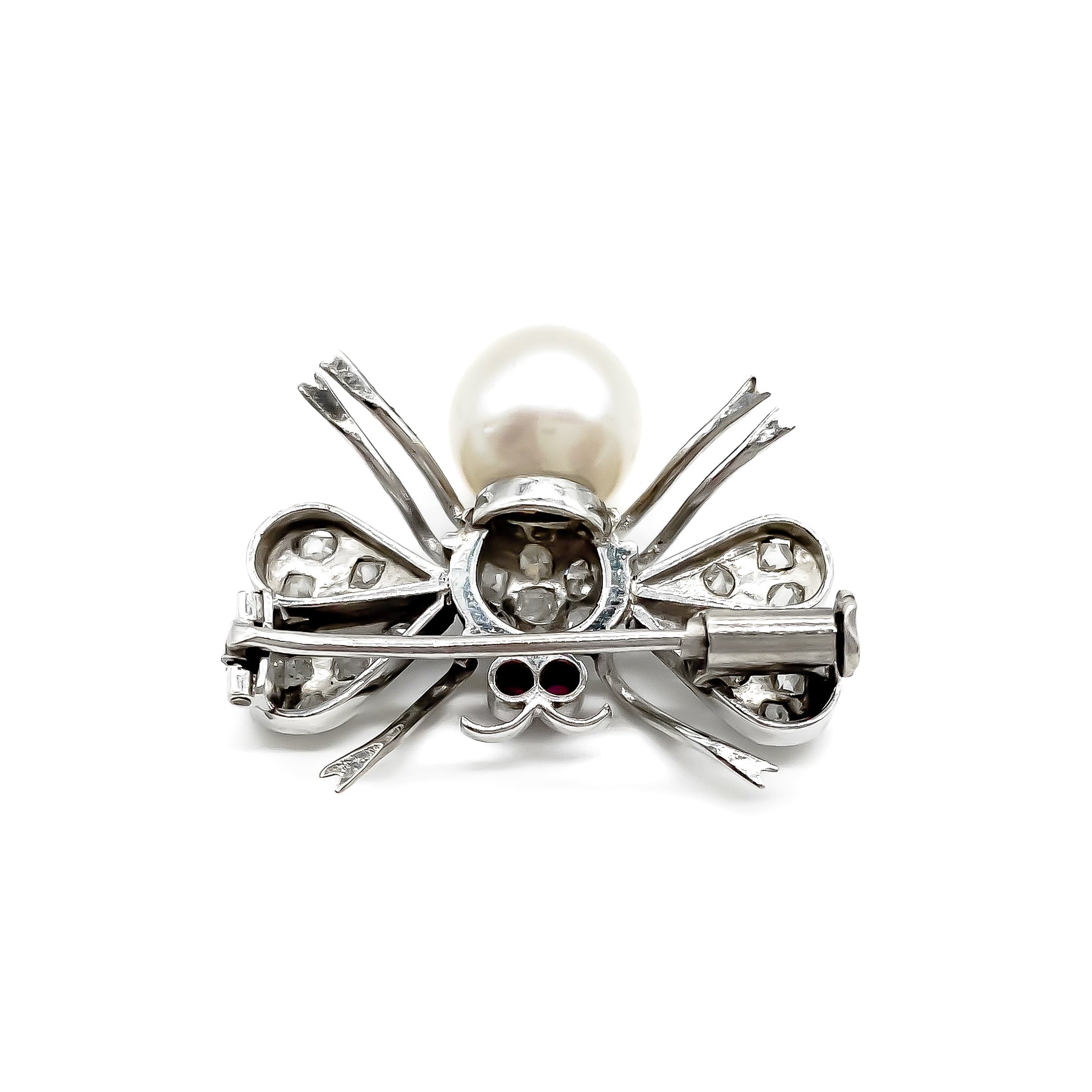 Dainty 18ct white gold insect brooch with diamonds on the wings and thorax, ruby eyes and a pearl abdomen. 