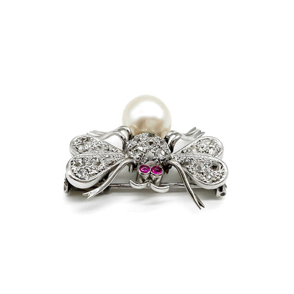 Dainty 18ct white gold insect brooch with diamonds on the wings and thorax, ruby eyes and a pearl abdomen. 