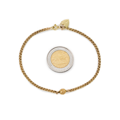 Delicate vintage 18ct gold Albertina bracelet, with a beautifully engraved ball and a heart shaped charm.