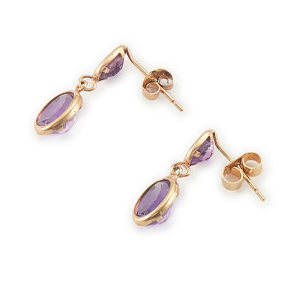 Dainty vintage 9ct gold drop earrings, each with two tube-set faceted purple amethyst stones.