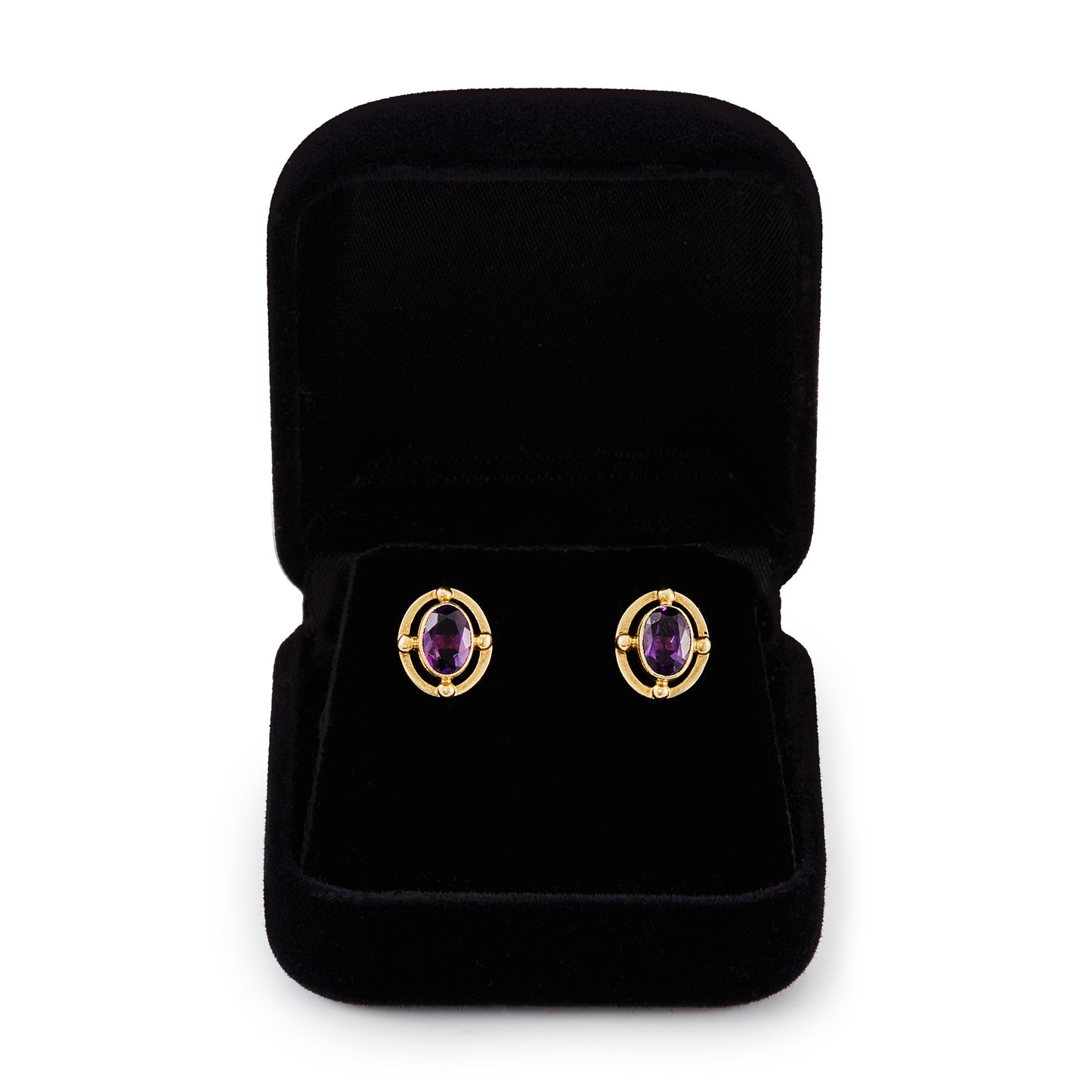 Classic 9ct gold stud earrings, each set with a beautifully faceted deep purple oval amethyst.