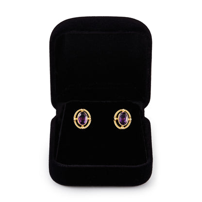 Classic 9ct gold stud earrings, each set with a beautifully faceted deep purple oval amethyst.