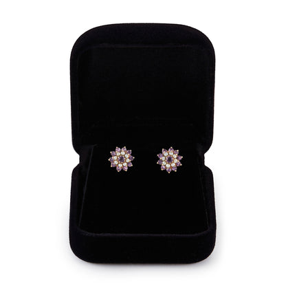 Pretty 9ct gold stud earrings, with beautifully faceted amethysts and seed pearls which are claw-set in the shape of a flower.