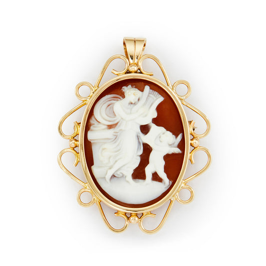 Charming cameo pendant depicting a finely carved classical scene of a figure and a cherub, in a lovely 9ct yellow gold setting. Can also be worn as a brooch.