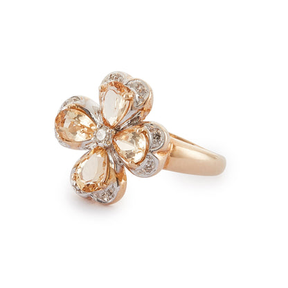 Charming 9ct gold ring set with beautifully faceted citrines and small diamonds in the shape of a four-leaf clover, a symbol of good luck and fortune.