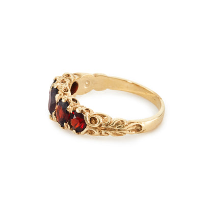 Lovely 9ct gold ring set with five beautifully faceted deep red oval garnets.