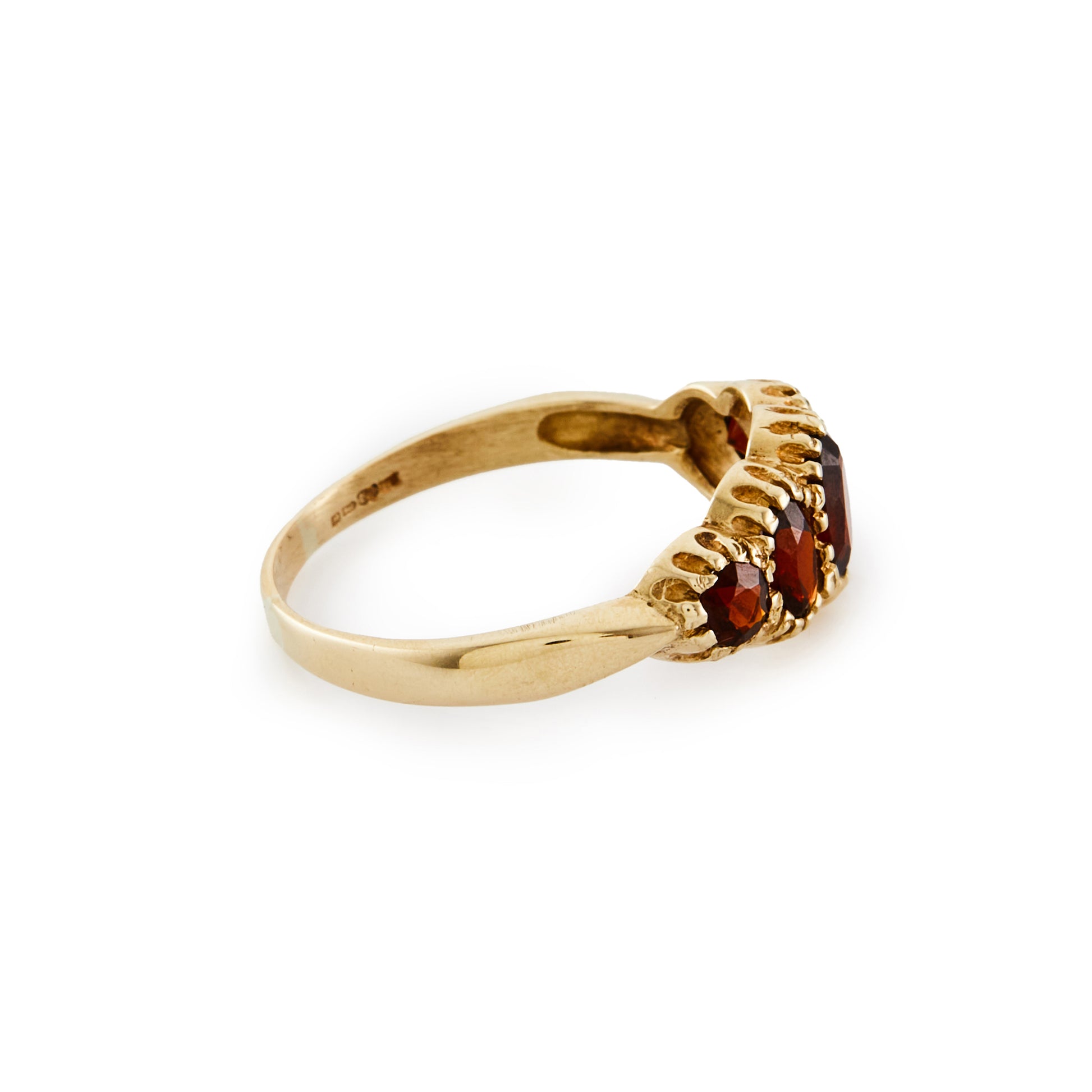 Lovely 9ct gold ring set with five beautifully faceted deep red oval garnets.