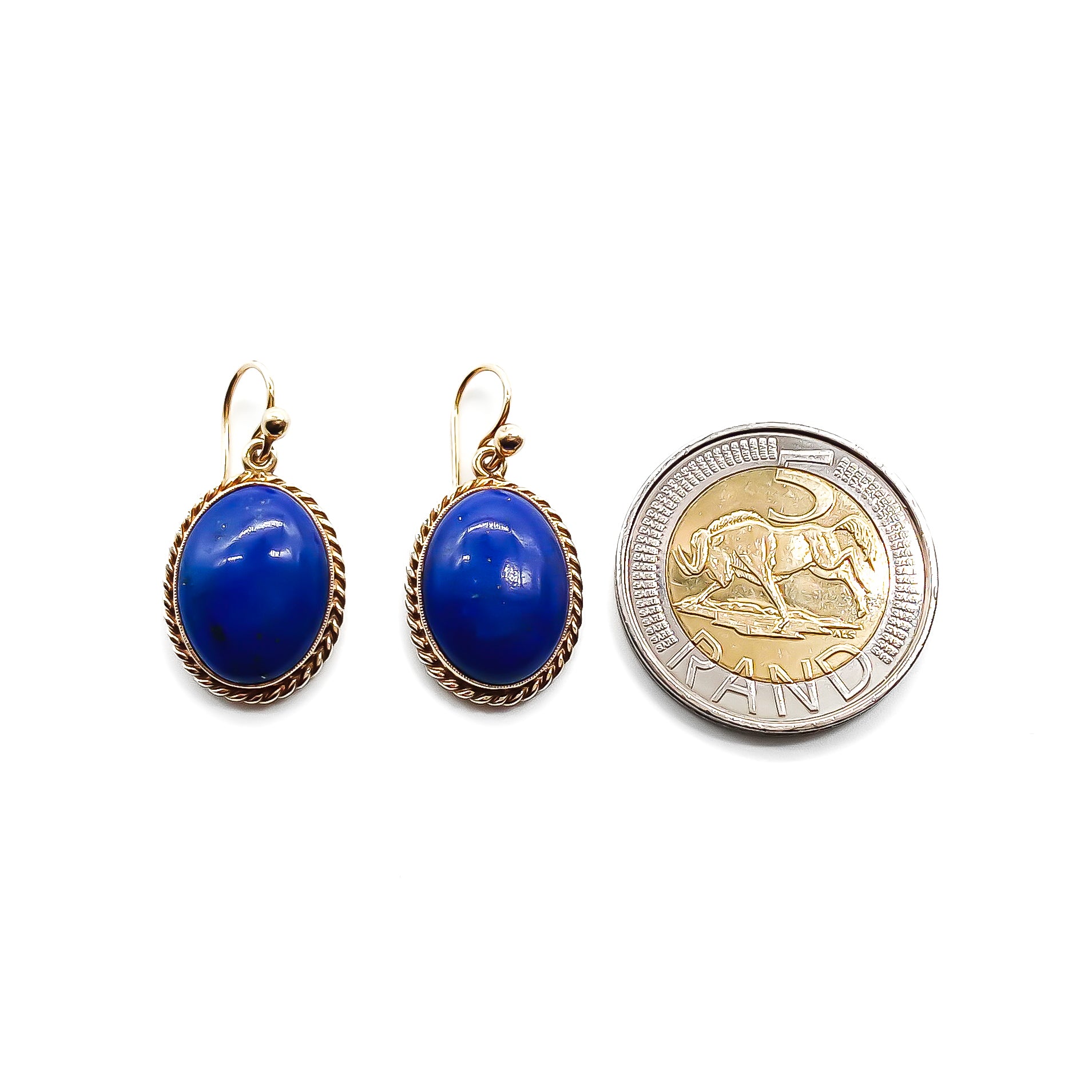 Lovely 9ct yellow gold earrings, each set with a deep blue lapis lazuli cabochon. Circa 1950’s