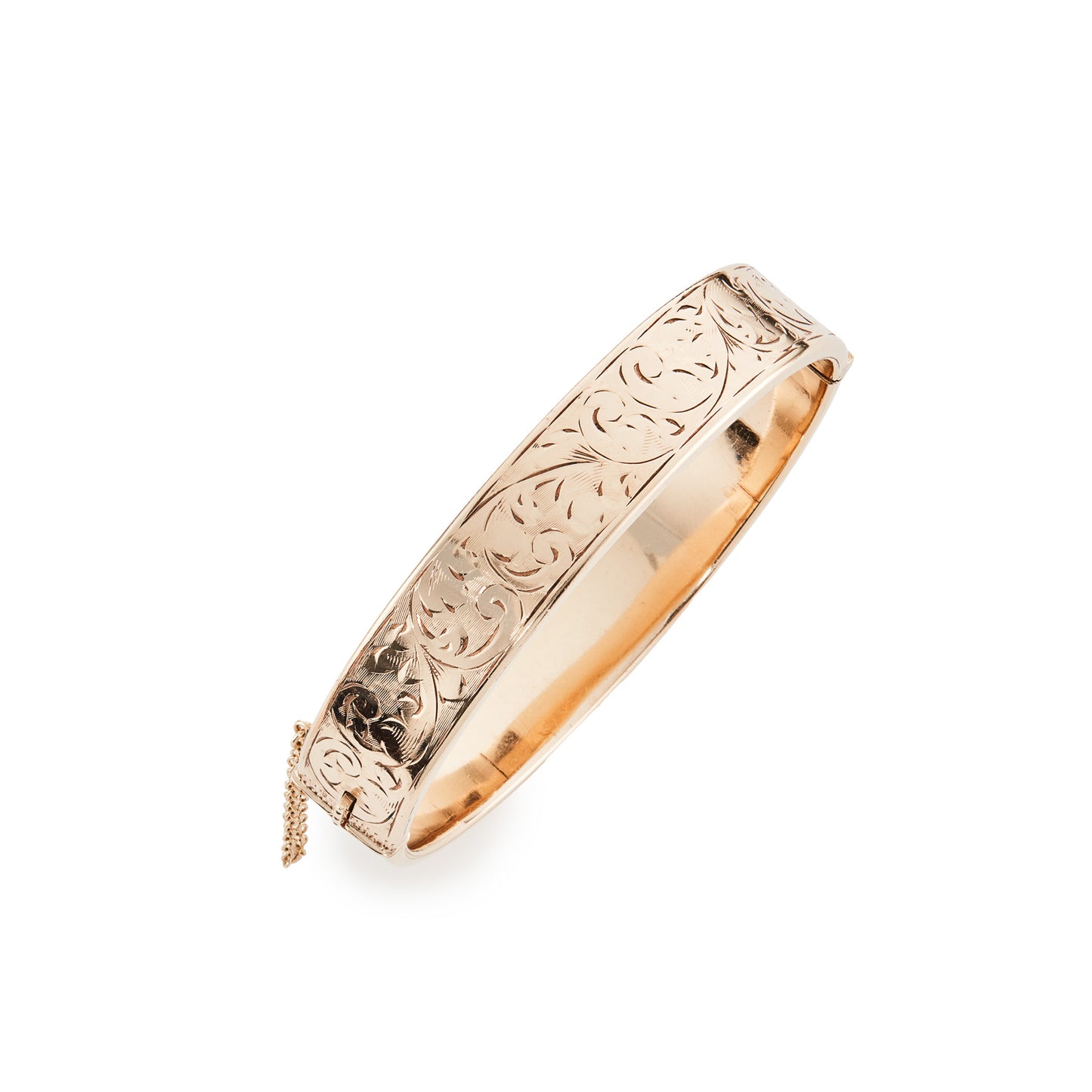 Beautifully engraved vintage 9ct gold metal core bangle. Stamped ⅕th 9ct metal core. Safety chain attached.