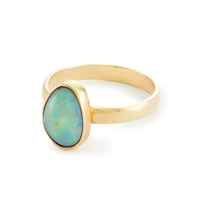Stylish vintage 9ct gold ring with a vibrant blue-green opal in a tube setting.