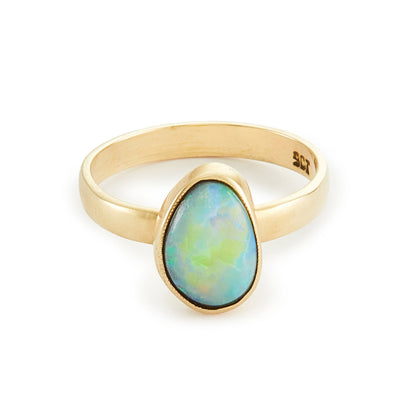 Stylish vintage 9ct gold ring with a vibrant blue-green opal in a tube setting.
