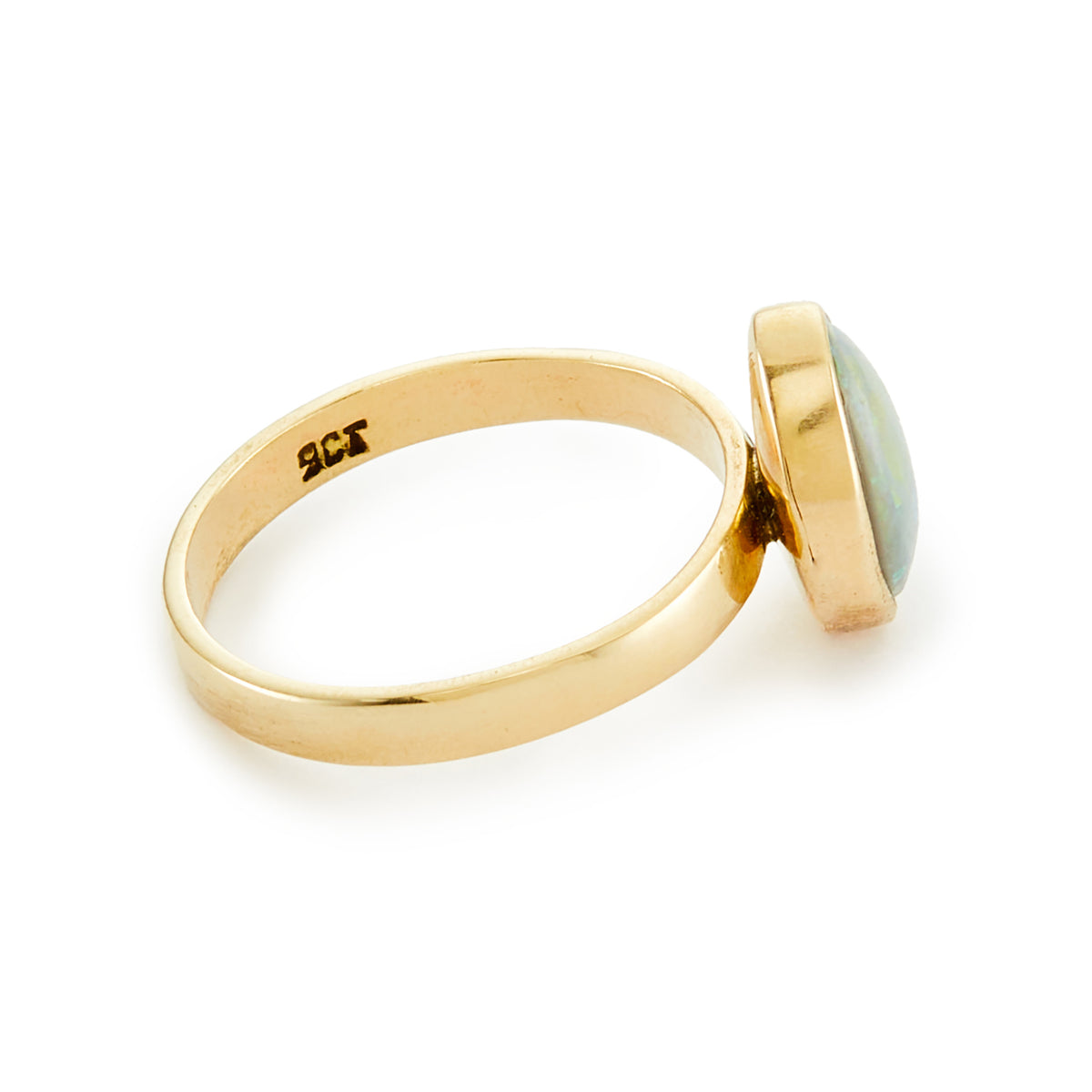 Stylish vintage 9ct gold ring with a vibrant blue-green opal in a tube setting.