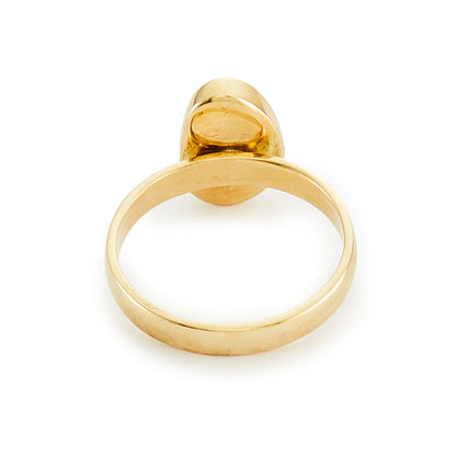 Stylish vintage 9ct gold ring with a vibrant blue-green opal in a tube setting.